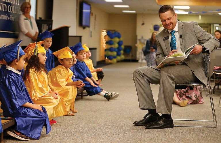 Dr. Joe Schaffer reads to students during the graduation ceremony