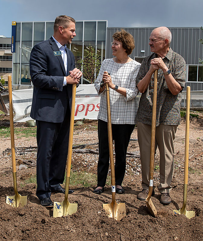 LCCC President Dr. Joe Schaffer speaks with Dr. Sandra Surbrugg and her husband Dr. Bob Prentice at the groundbreaking ceremony for the Surbrugg Prentice Auditorium; the facility is scheduled to open this winter.
