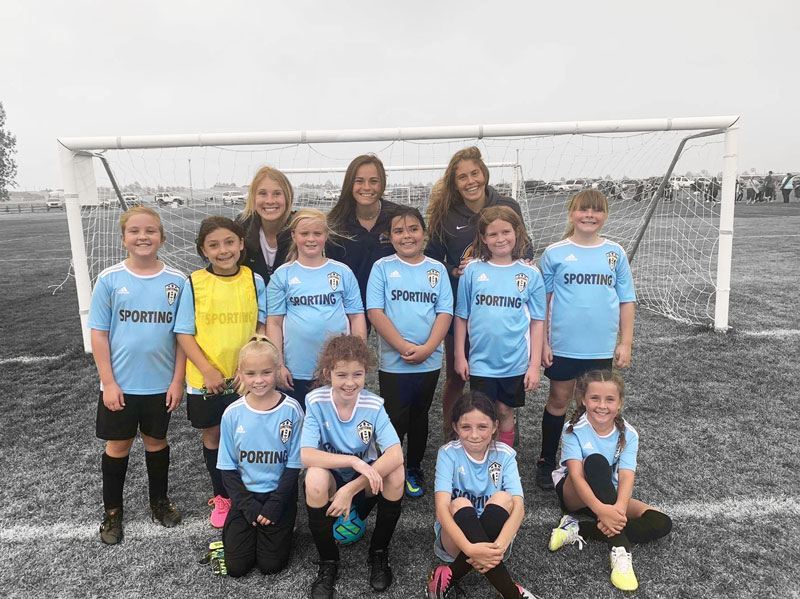 LCCC Women's Soccer team coaching a girls teams for the Cheyenne Soccer Club