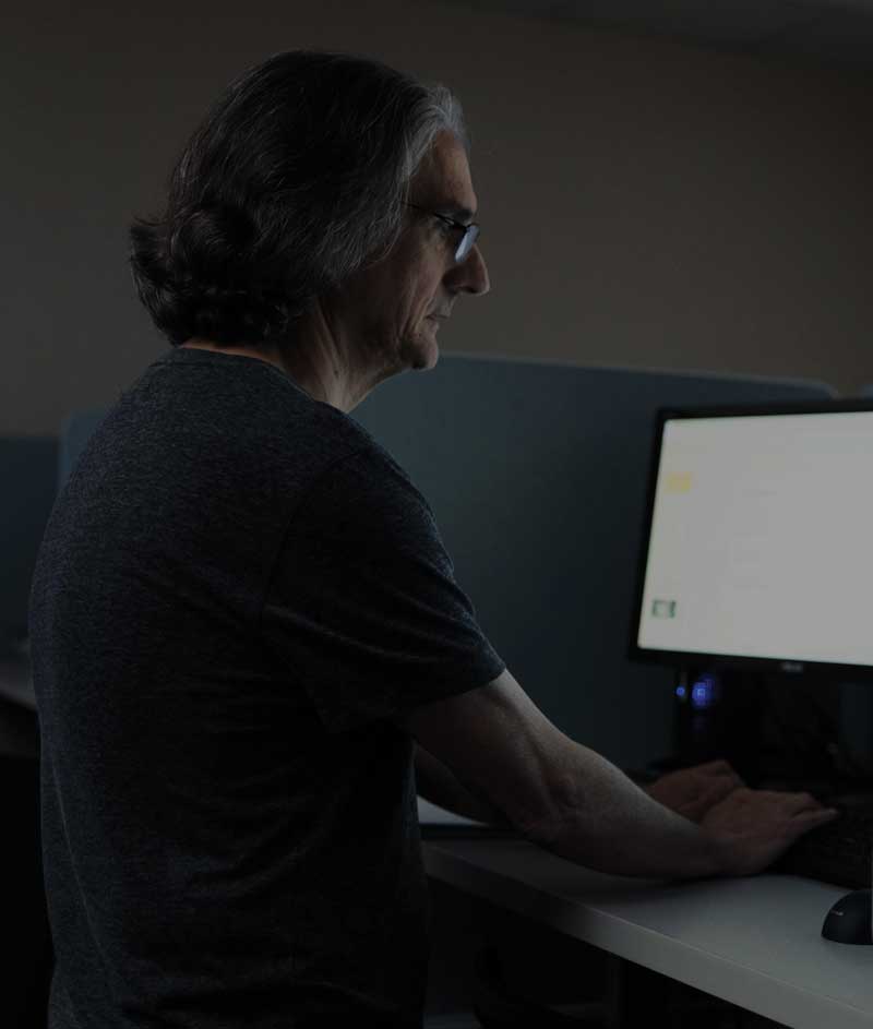 An AI student working on a computer