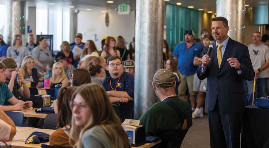 President Schaffer speaks in the Dining Hall to students and families during the Kickoff event on campus