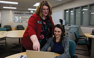 Carole Boughton talking with a student