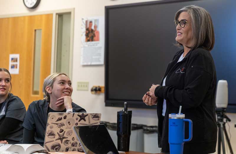 Angela Burge, nursing faculty, speaking in class to nursing students