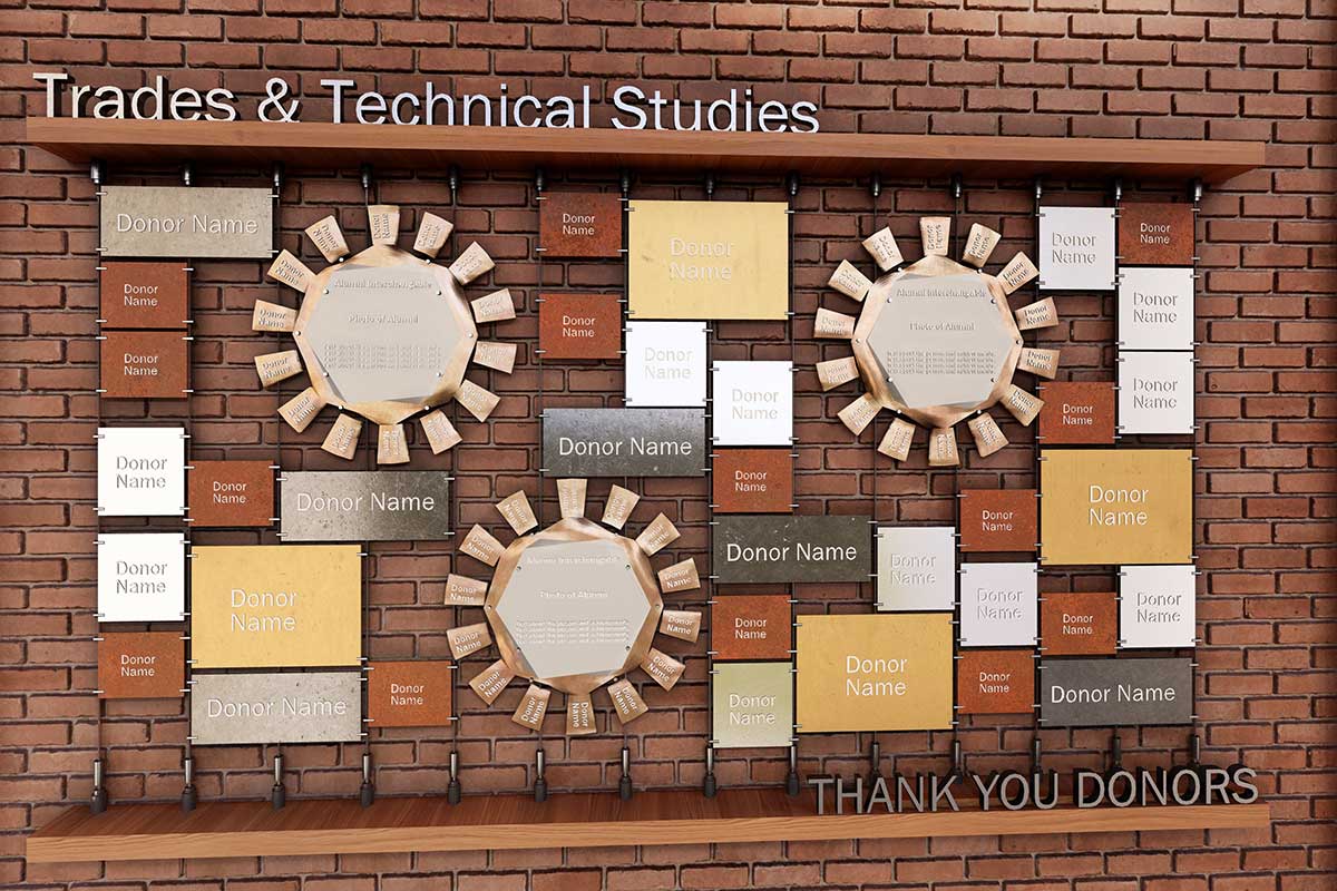 A 3D rendering straight on of the trades and technical studies pathway donor wall with brick in the background with donor names on plaques over it, some of which look like gears and the title on a wood shelf at the top.