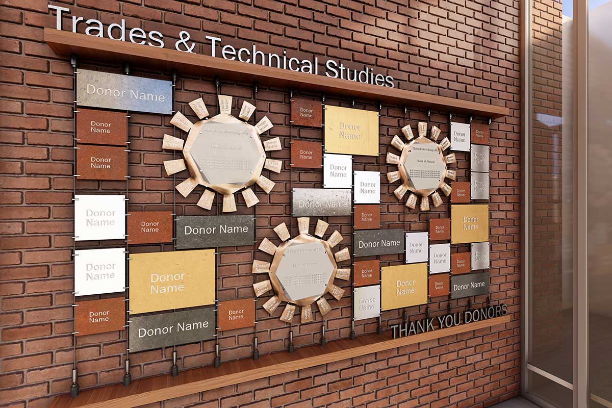A 3D rendering at an angle of the trades and technical studies pathway donor wall with brick in the background with donor names on plaques over it, some of which look like gears and the title on a wood shelf at the top.