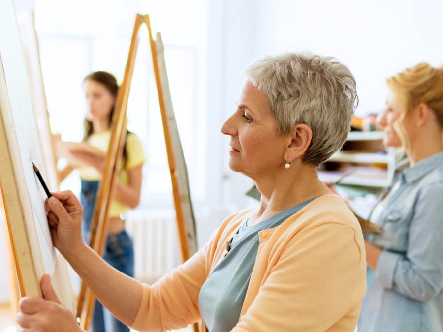 Woman drawing on an easel