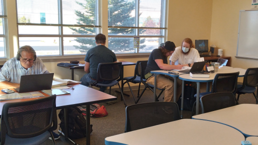 Several people studying in the learning commons