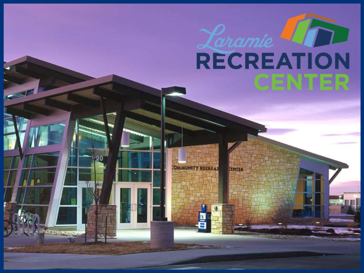 Image of rec center at dusk with Laramie Recreation Center logo in upper right corner