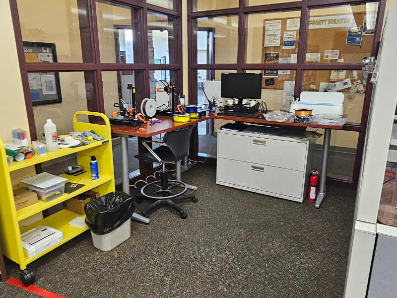 Wyrkshop with 3D printer and cricut machine and supplies for both