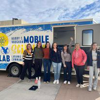 Students standing outside the Mobile Lab after helping with GIS Day