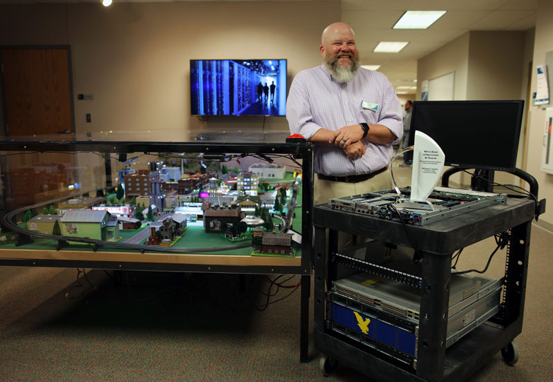 Troy Amick, program director, information technology at LCCC shows off the datacenter carts and Cyber City.  Amick was awarded the 2021 Innovation Award from Microsoft due to his creativity in developing unique and engaging learning environments.