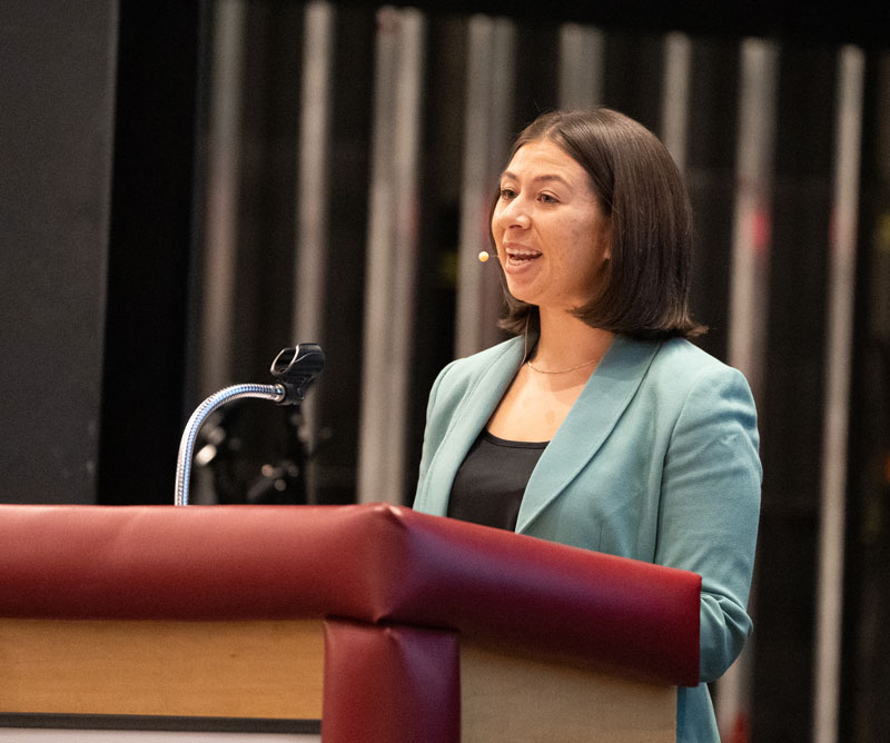 A student speaking at a podium during the Talon Talks