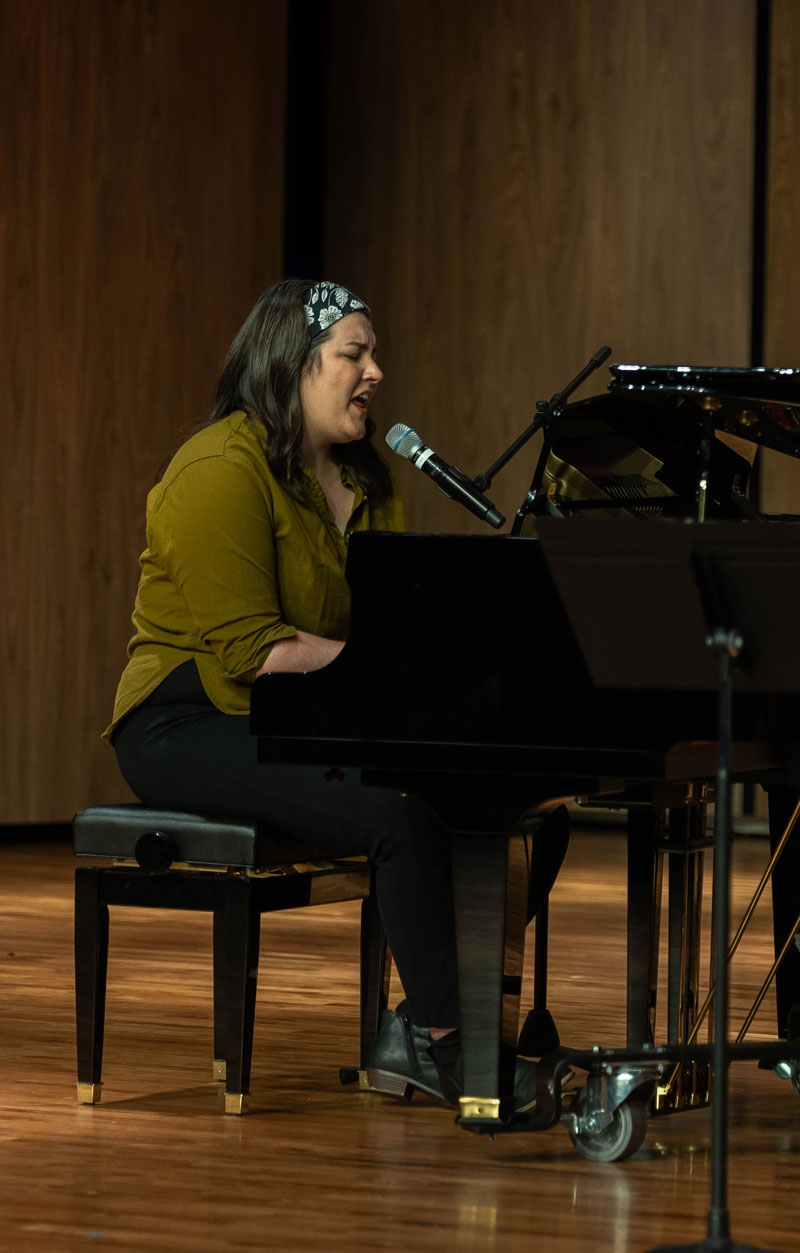 Julie Koenig playing piano during a concert at LCCC