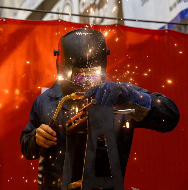 Photo of a student welding at Puma Steel