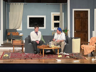 Two actors on stage during the Odd Couple play