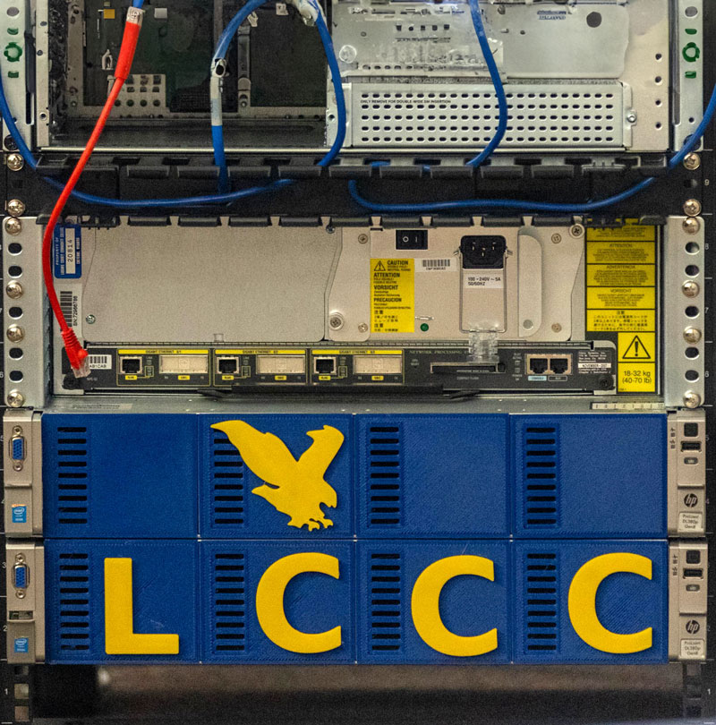 photo of the back of a computer with wires and inputs and LCCC