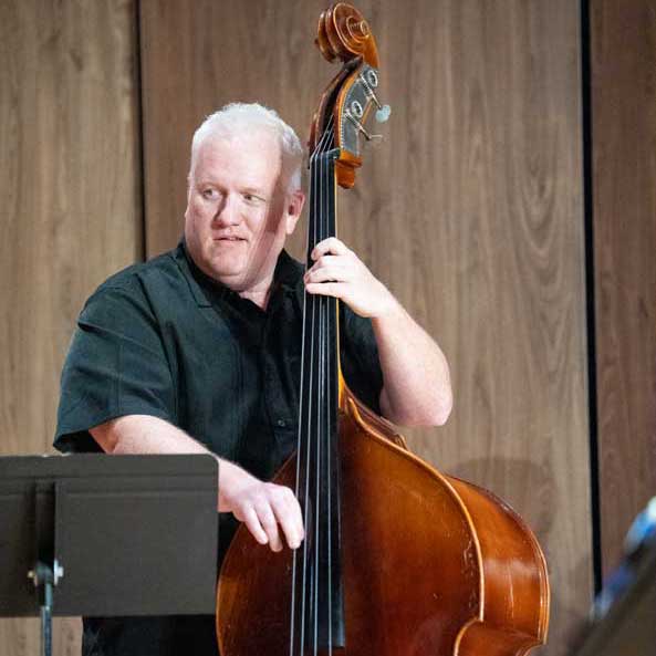 Photo of LCCC Music Faculty playing on stage with a bassphone, base and drums
