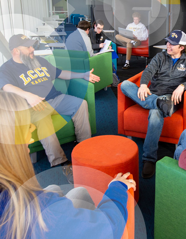 Photo of students sitting and talking in the library with circle graphics over it